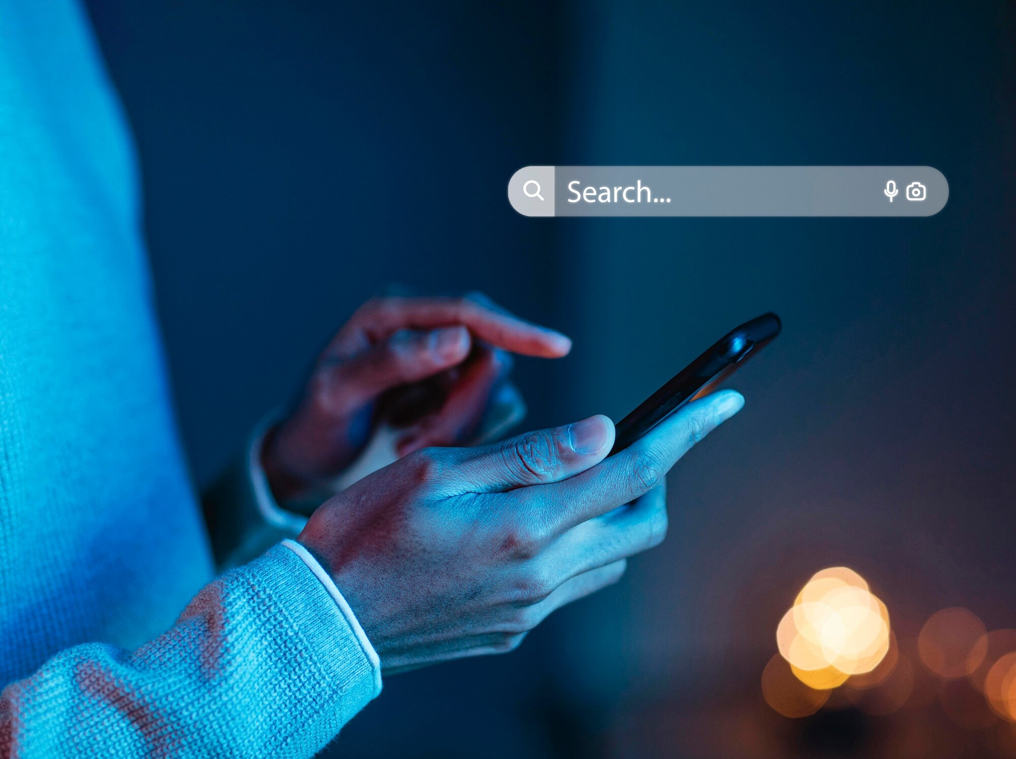 person using cell phone for the search engine in the dark